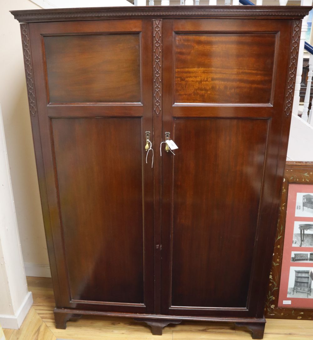 A 1920s mahogany compactum wardrobe, W.132cm, D.52cm, H.182cm